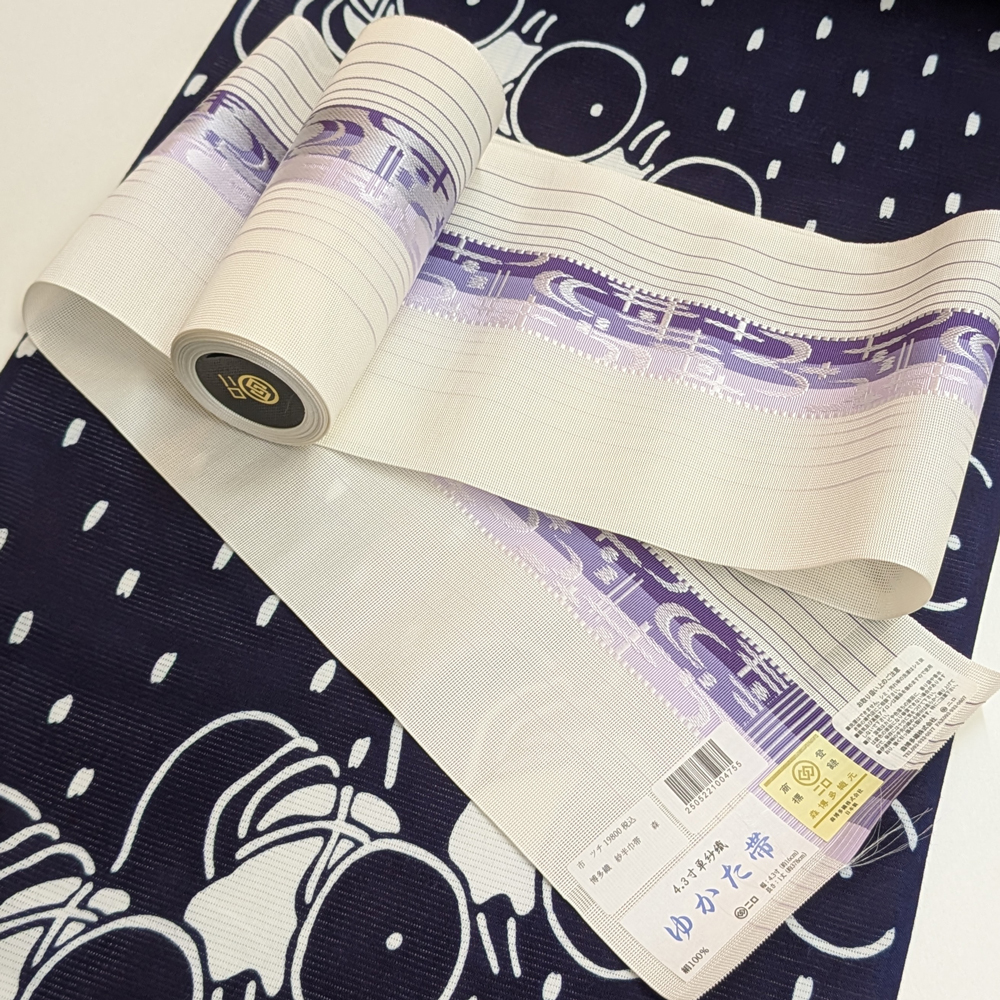 夏帯 本場筑前博多織の紗半幅帯【白紫 琉球絣文】 夏帯 本場筑前博多織の紗半幅帯【白紫 琉球絣文】