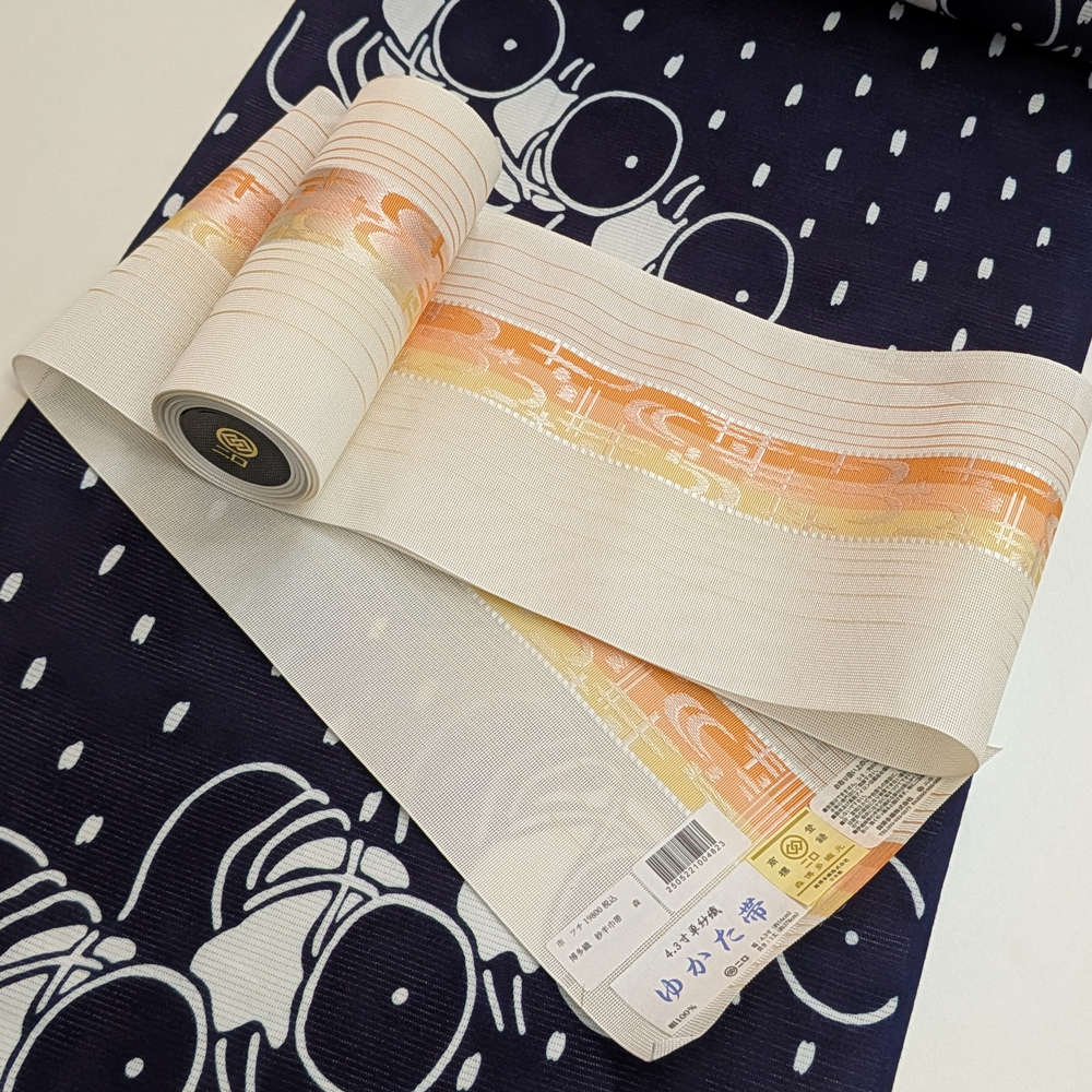 夏帯 本場筑前博多織の紗半幅帯【白橙 琉球絣文】 夏帯 本場筑前博多織の紗半幅帯【白橙 琉球絣文】